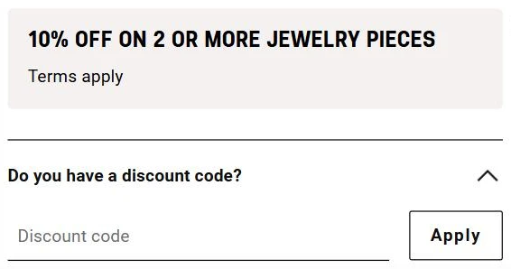 TOUS cart: a "10% off on 2 or more jewelry pieces" promotion box above "Do you have a discount code?", opened to a Discount code field with an Apply button